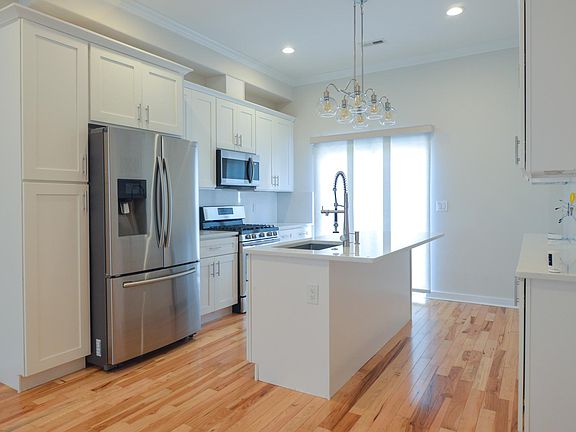 Kitchen with island and double sided cabinets