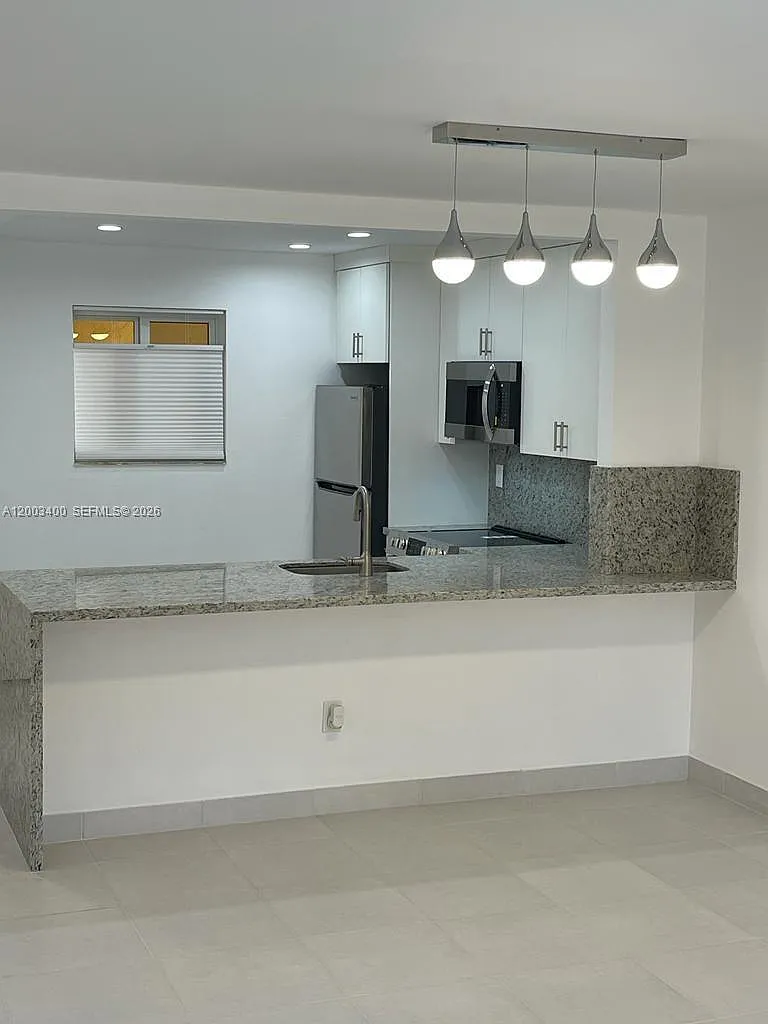 Building Photo - 7732 Camino Real #F-318