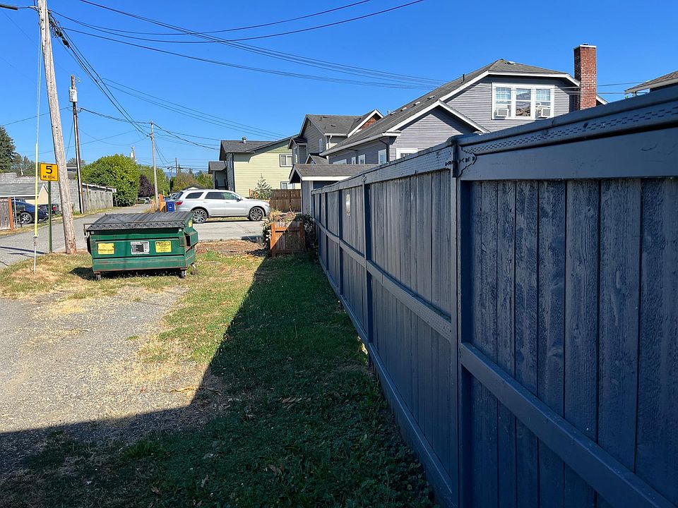 Fully fenced yard with neatly maintained alley access
