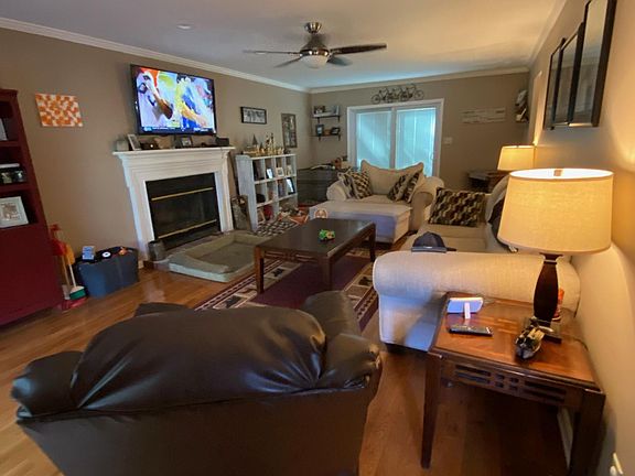 Living room with sliding glass door that leads to the deck.