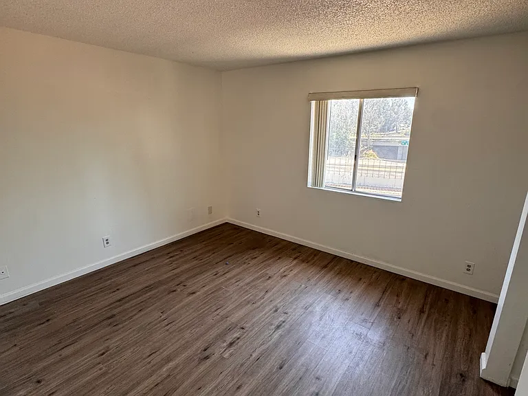 Spacious bedroom with large window