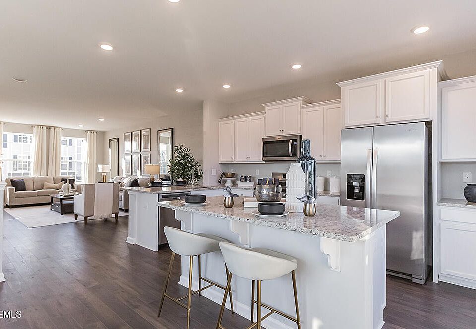 Open floor plan with kitchen, eat-in size dining room and living space