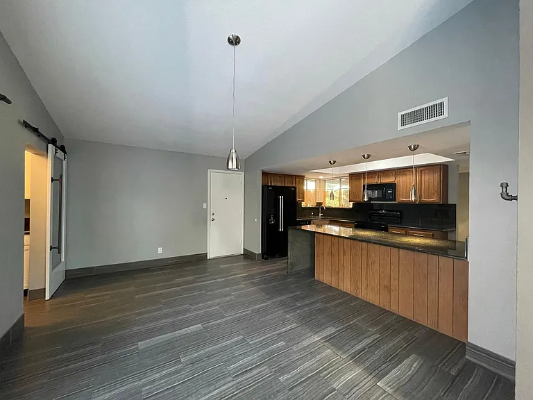 Looking into the Kitchen on the right and Wine Closet on the left.