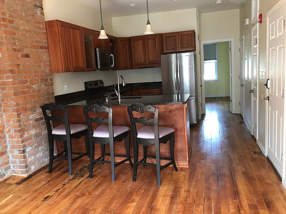 Beautifully, updated, while keeping the original charm of brick and hardwood floors. Lots of storage space throughout.