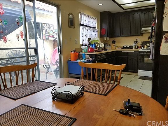 Dining area opens to back patio. Spacious kitchen with lots of recently painted cabinets and lots of countertop space..