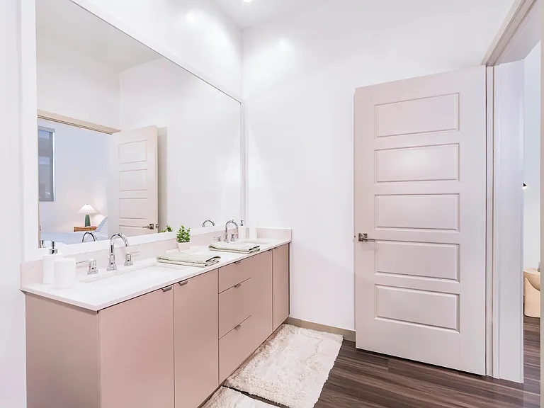 Indulge in designer bathrooms with double vanities, quartz counters, and linen closets.