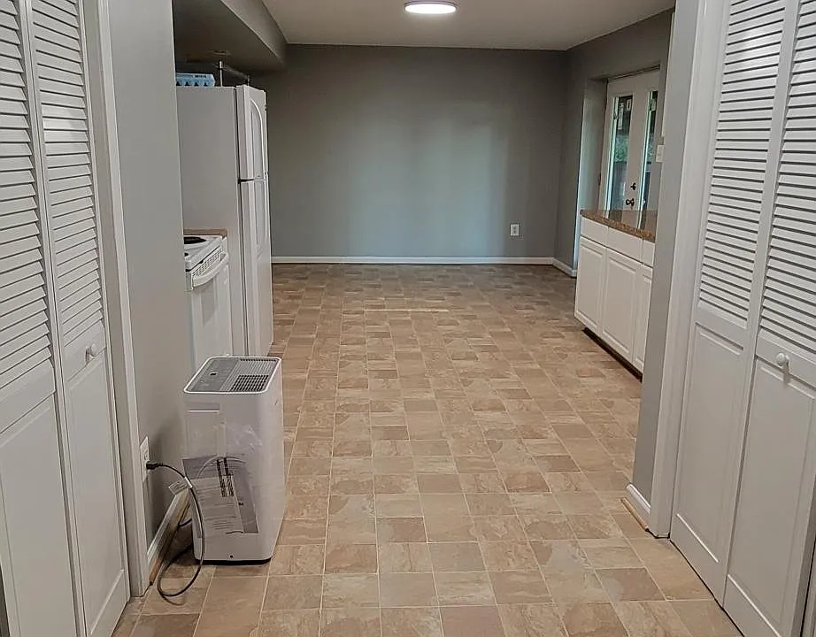 View from hallway, utility closet on the left and laundry on the right.