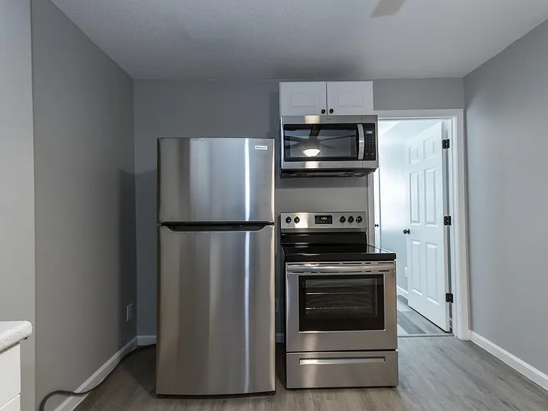 New stainless steel refrigerator, range, and microwave