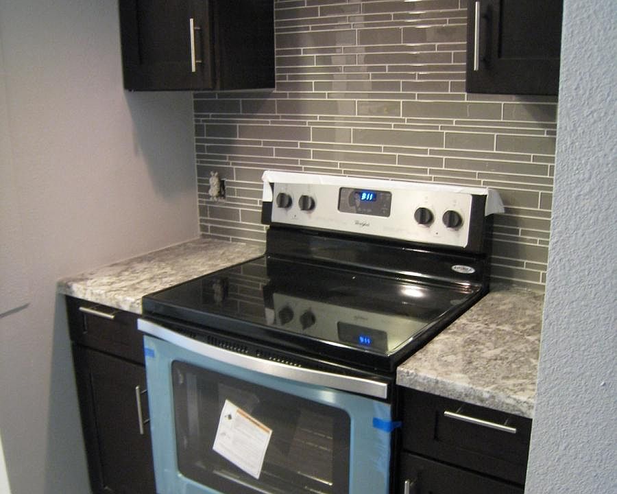 Brand new stainless steel range and hood