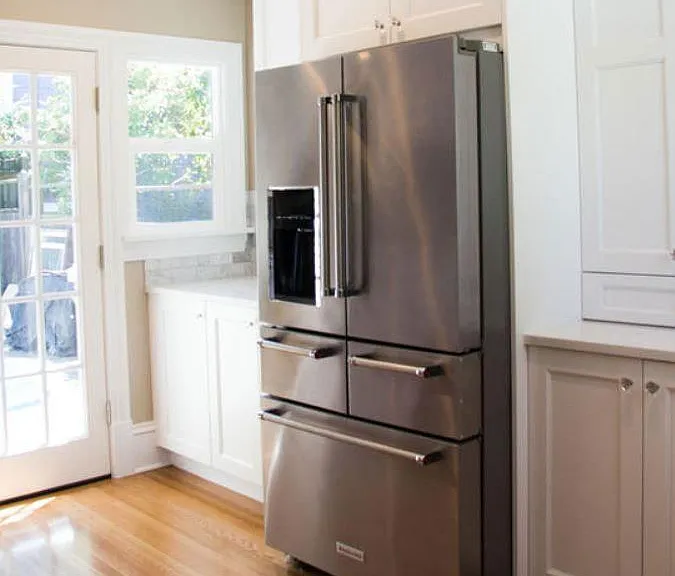 High End appliances and floor to ceiling pantry cabinets