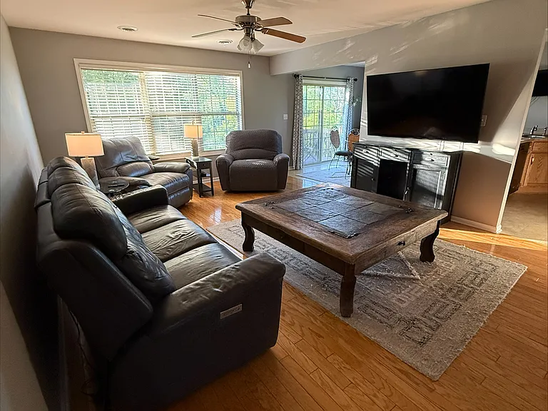 Furnished with quality furniture like La Z Boy. Auto reclining real leather couch!