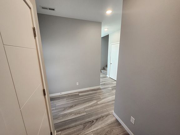 Entrance from the garage walking into the unit. Large storage closet off of garage entrance.