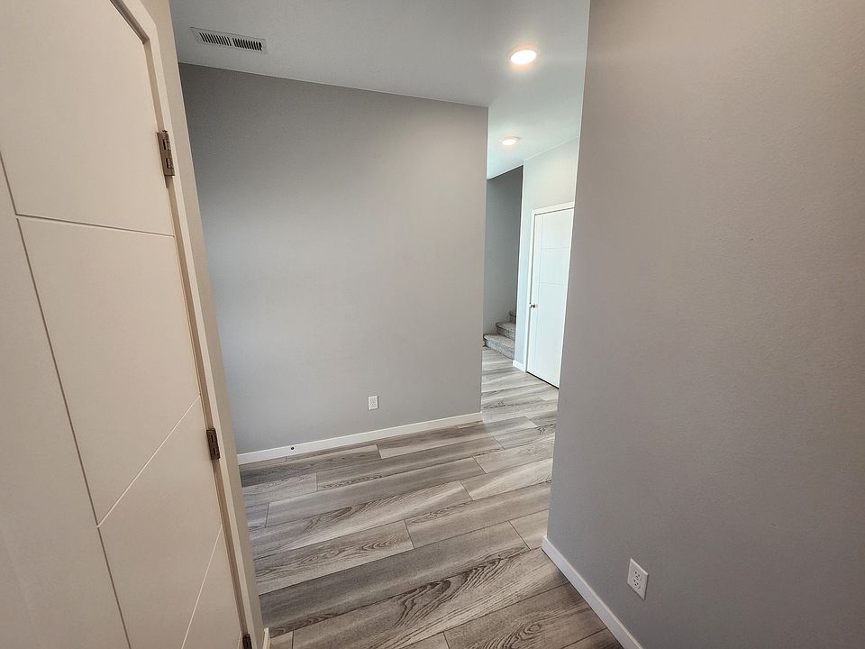 Entrance from the garage walking into the unit. Large storage closet off of garage entrance.