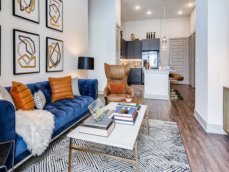 Griffis Frisco apartment living room with wood style floor.