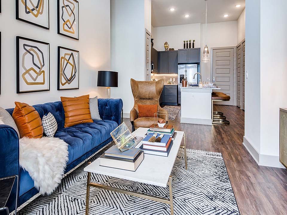 Griffis Frisco apartment living room with wood style floor.