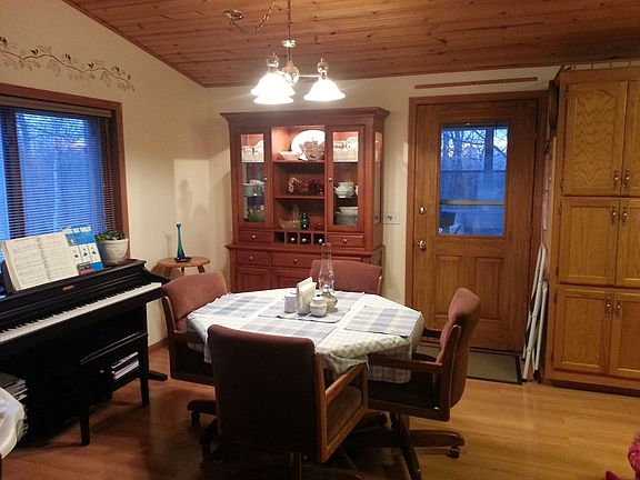 Dining area opens to 3-seasons room