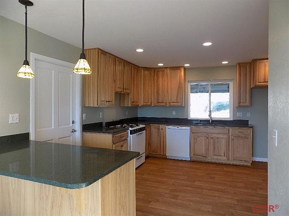 Kitchen has new cabinets, floor, counter tops, fixtures and floor.