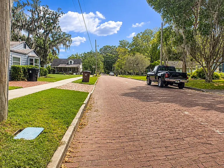 Exterior view of the quiet residential brick street.
