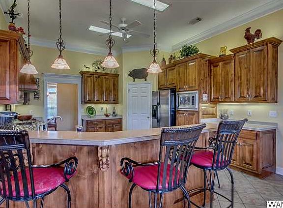 The kitchen is Hugh!!  Big enough for an island if you wanted one.   Features a bar area lots of cabinet space and also has a walk in pantry