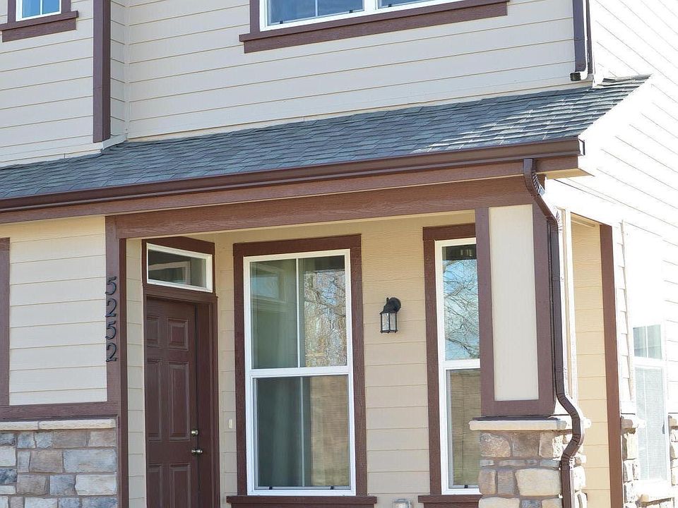Front Covered Patio/Entry; faces green space