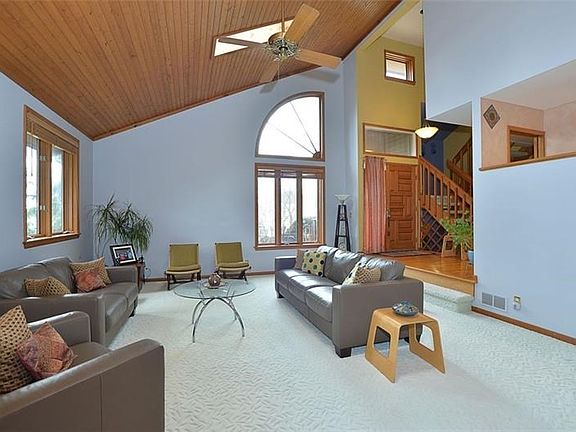 The great room is also open to the kitchen and features interesting ceiling lines and architecturally interesting windows.
