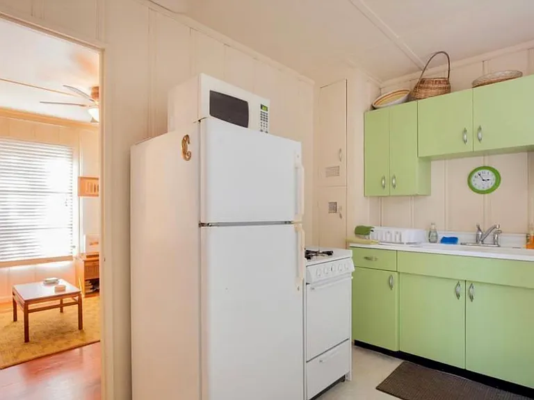 full size kitchen, with oven, microwave, coffee maker, toaster, plenty pots and pans and utentsils