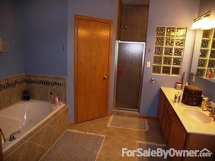 Master Bathroom
						:
						whirlpool tub, his/hers walk-in closets, dual vanity and custom tile shower