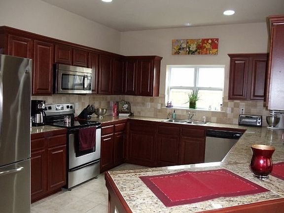 Kitchen w granite counters, stainless appliances