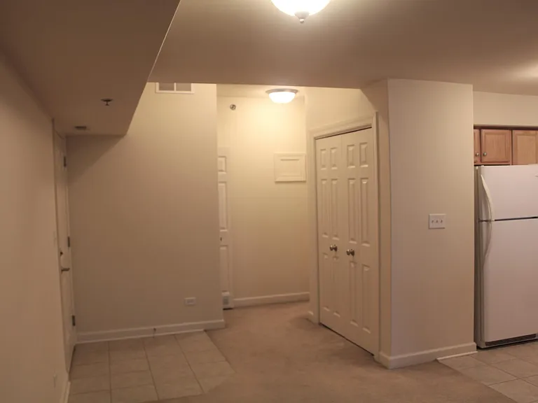 View of front door from bedroom.