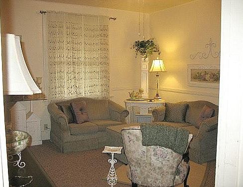 The living room has ample space for couches and large TV