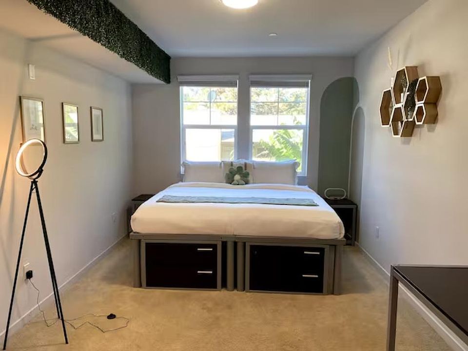 Cozy up in one of the two bedrooms! Enjoy your own private bedroom equipped with a king-size bed and desk/chair.