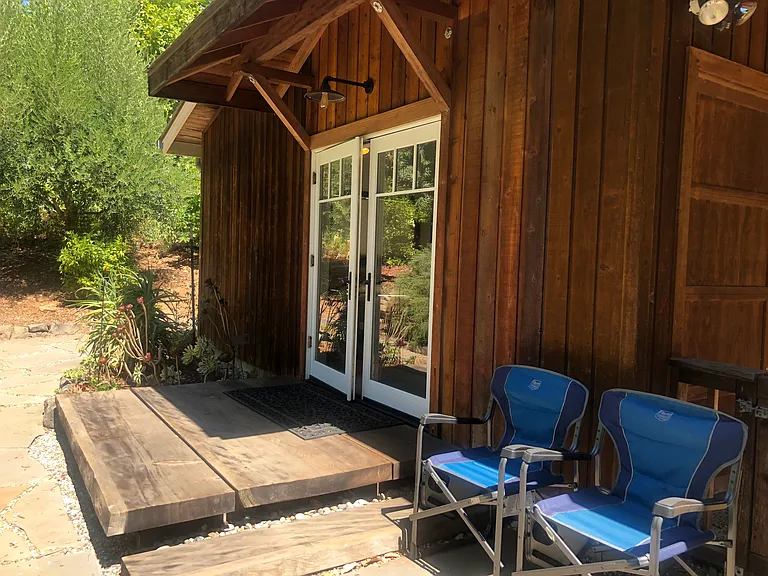 Front Entrance - French doors with redwood slab deck