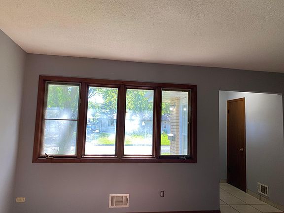 Upstairs living room. Lots of windows and hardwood floors