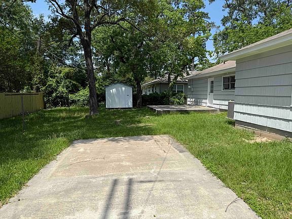 Back yard with storage shed and patio