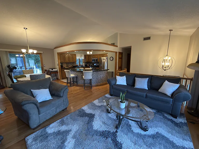 Shared furnished upstairs kitchen, dining, and living spaces