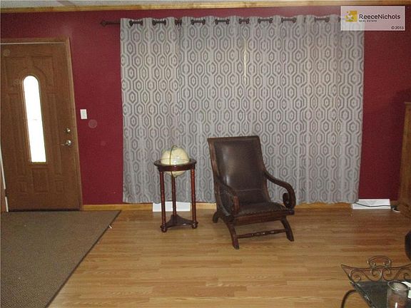 A large double window lets in the sunlight as you relax in your new living room.