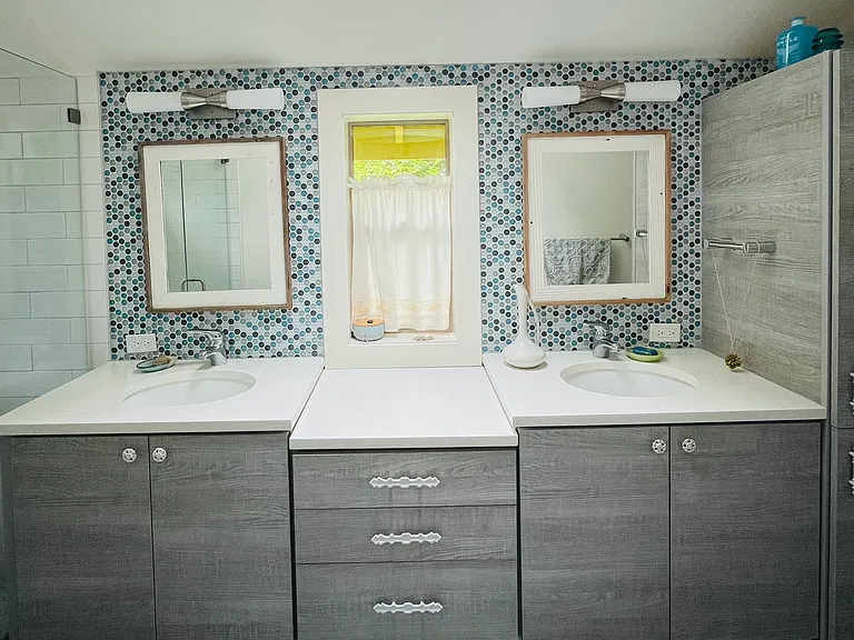 Master bathroom with two sinks and shower