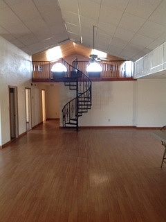 Living room view to loft & dining area