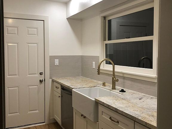 renovated kitchen, ceramic cast iron sink, open shelving not pictured