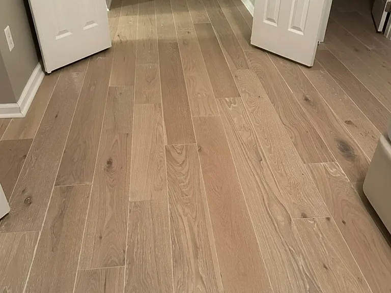 Brand new hardwood floors on top level with three bedrooms and two full bathrooms