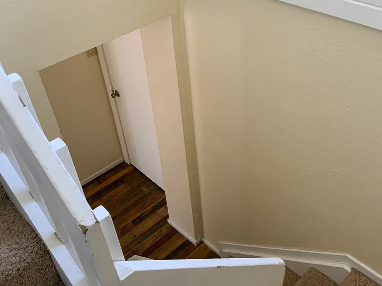 Stairway to heaven and the cozy two bedrooms and one bath on the second story.