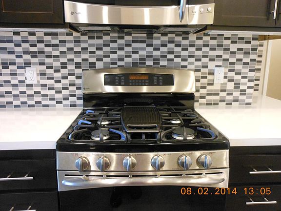 GE Profile Stainless Gas stove and Microwave oven