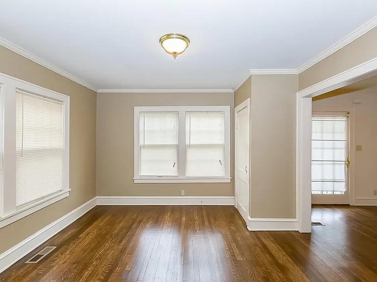 The dining room has a closet for dishes or other items. The Hardwood Floors have been refinished throughout the house.