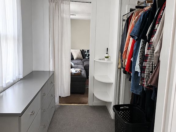 Walk-in closet adjacent to the primary bedroom.