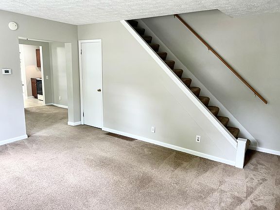 Family room with view into dining and kitchen