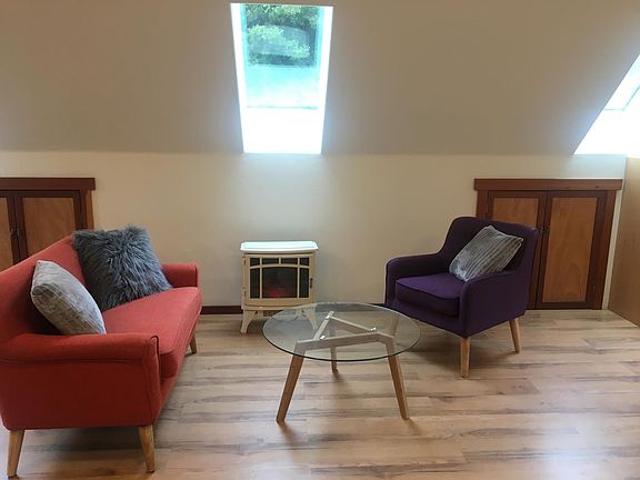 Natural light from skylights and windows on all sides. Forest views from three sides. (Staging furniture not included.)