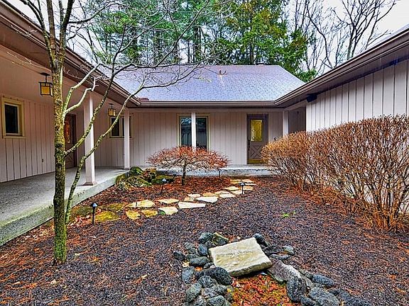 Entry courtyard with water fountain and covered porch.