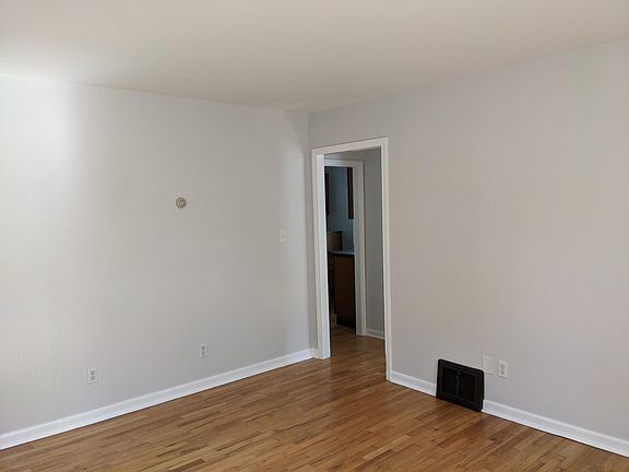 Living Room Looking Towards Bathroom and Kitchen