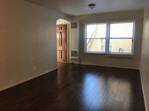 Living room towards the front door entryway.