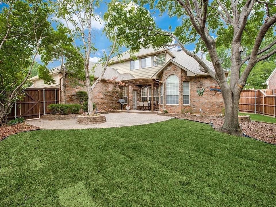 spectacular backyard with board-on-board fence surround.